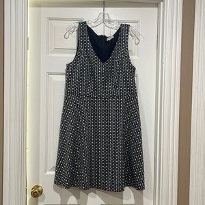 Black and white sleeveless v neck dress.